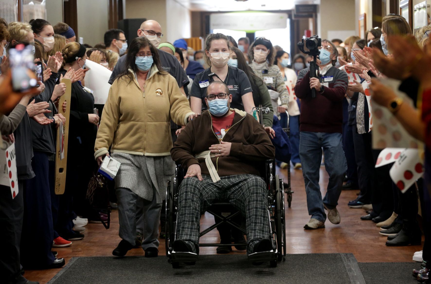 Staff cheers as COVID-19 survivor Joshua Miller discharged from St. Luke's Hospital